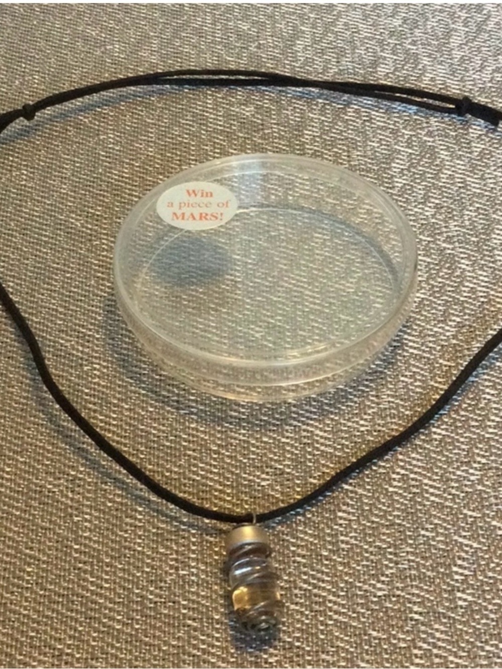 A Piece of Mars pendant on a black adjustable cord Necklace